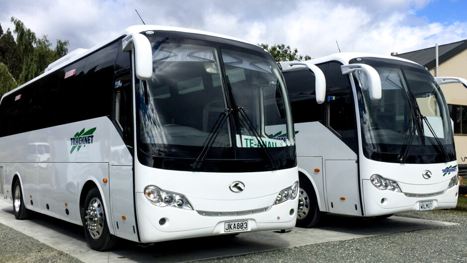 Tracknet buses ready for Fiordland journeys - reliable transport for Milford, Routeburn &amp; Kepler Tracks.
