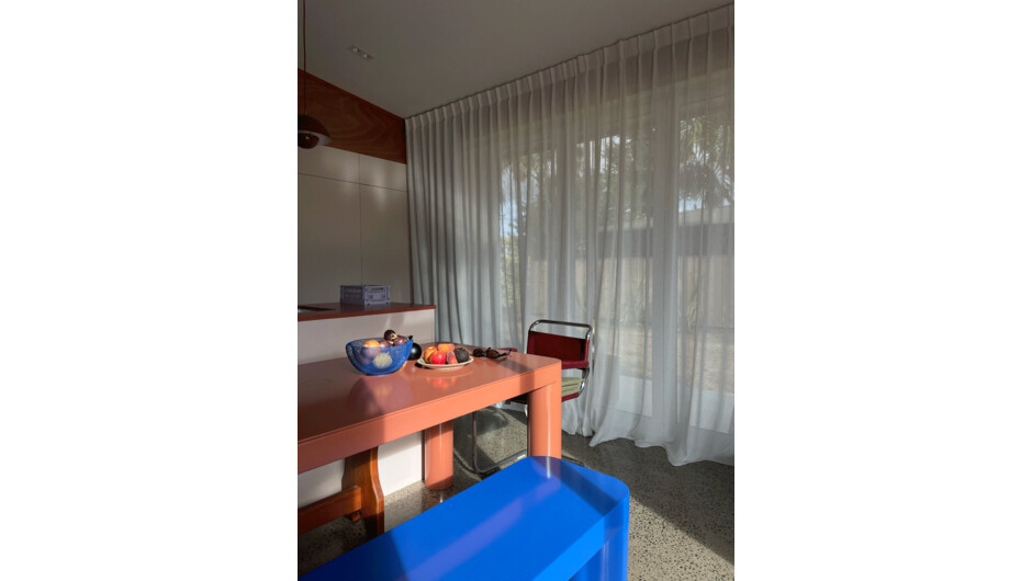 Kitchen and dining with bi-fold doors that open up to the outside