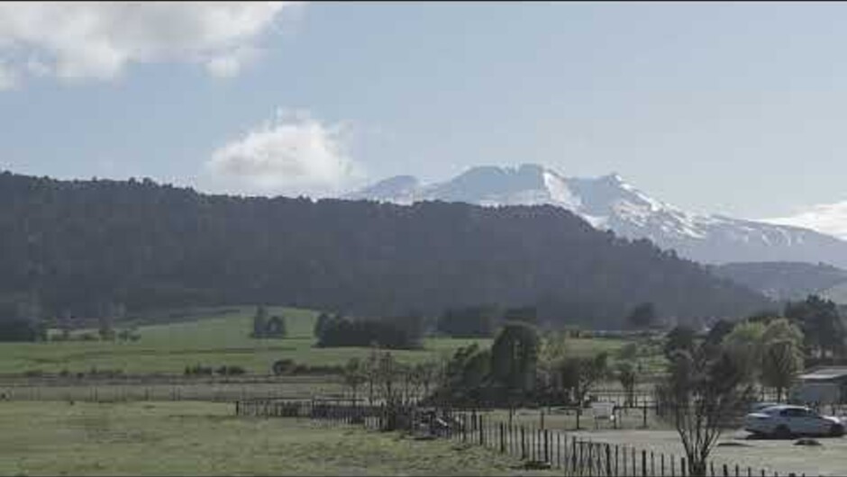 Soar above the meeting of two mountain streams, revealing native beech trees, open countryside and views towards Mt Ruapehu.
