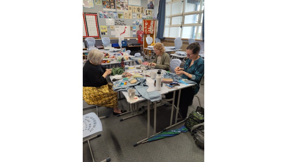 Students work on their creative repairs during their Visible Mending with a Speedweve Darning Loom Workshop.