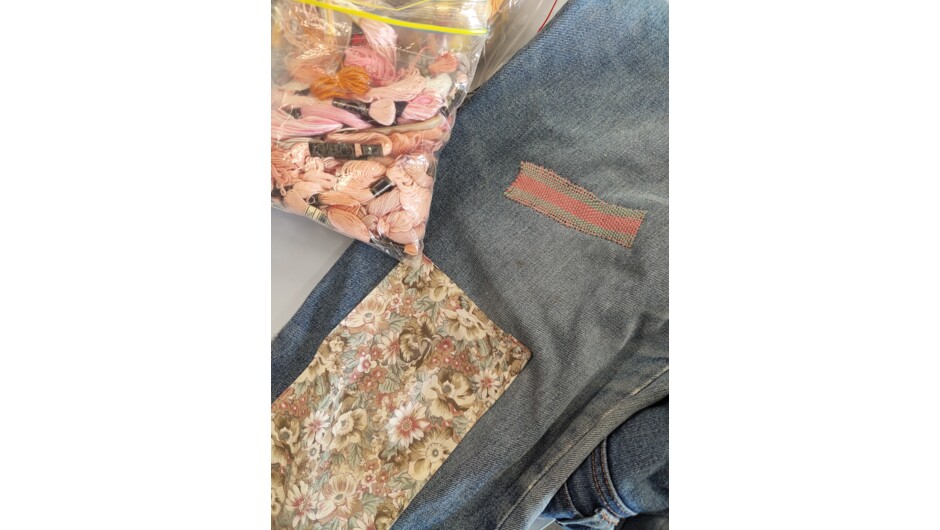A students work repairing a hole in a pair of jeans at their Visible Mending with a Speedweve Darning Loom Workshop.