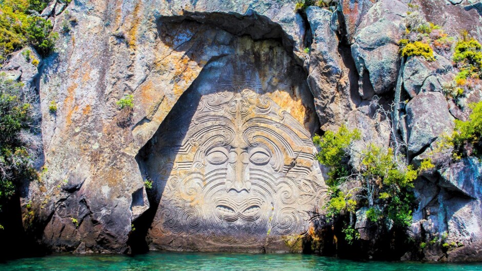 Cruise on Lake Taupō to view contemporary Māori rock carvings