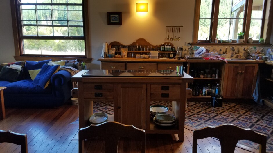 The farmhouse kitchen is comfy and a wood stove is the heart of the house.