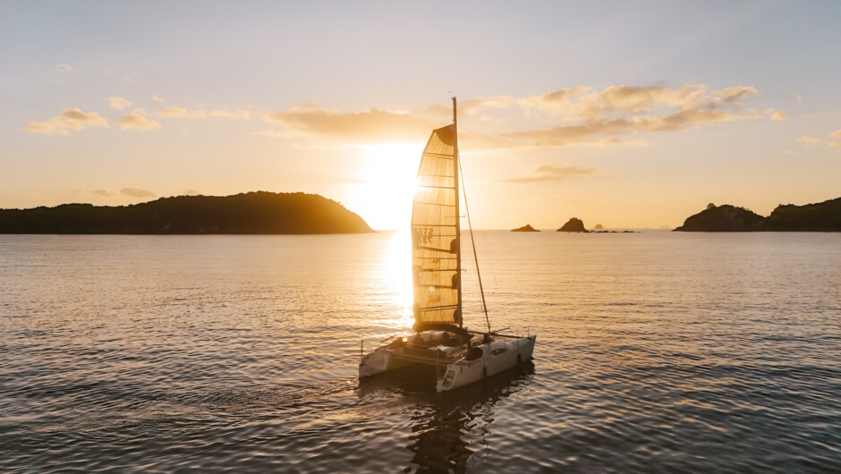 Sailing onboard Tu Meke at Mercury Bay at dusk