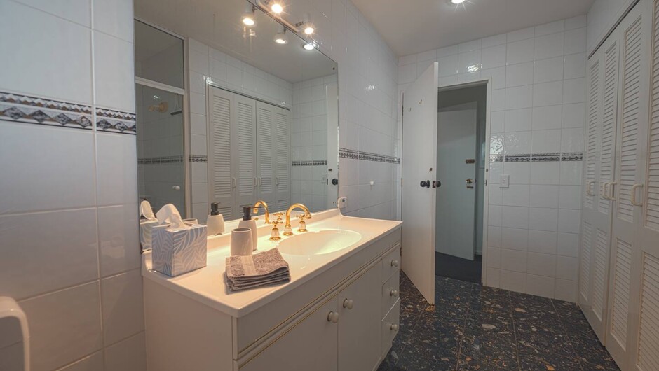 Private bathroom with shower and laundry facilities