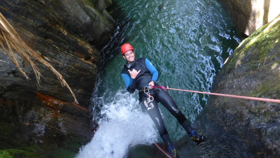 A person abseiling down a 12 metre waterfall