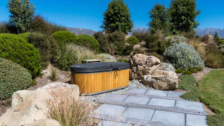 Fabulous cedar clad, double stainless steel hot tub set in beautiful garden surroundings off the bedroom deck.