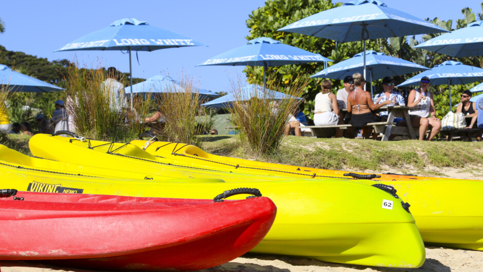 Kayaks and picnic tables at Otehei Bay