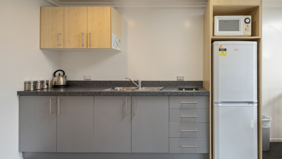 One Bedroom Unit Kitchenette - features stovetop, fridge, microwave, crockery &amp; cutlery and all the basics for preparing simple meals.