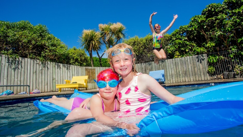 Children having fun in the pool.