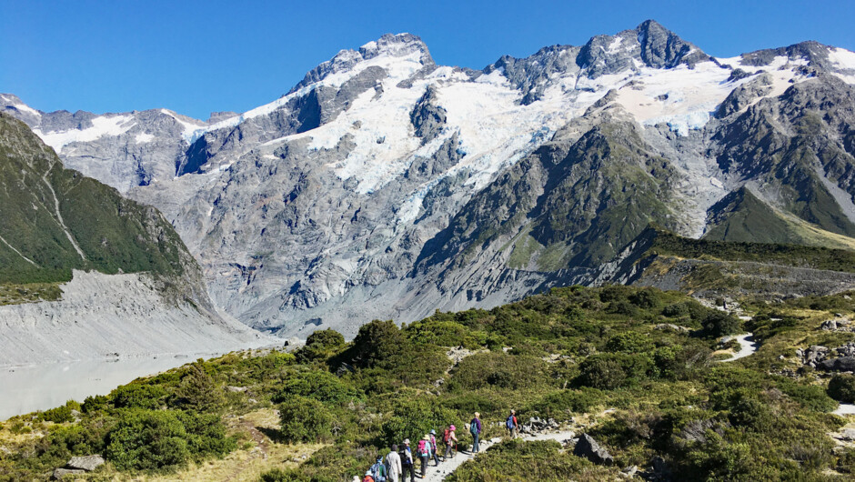 Our short hike under towering glacier capped peaks