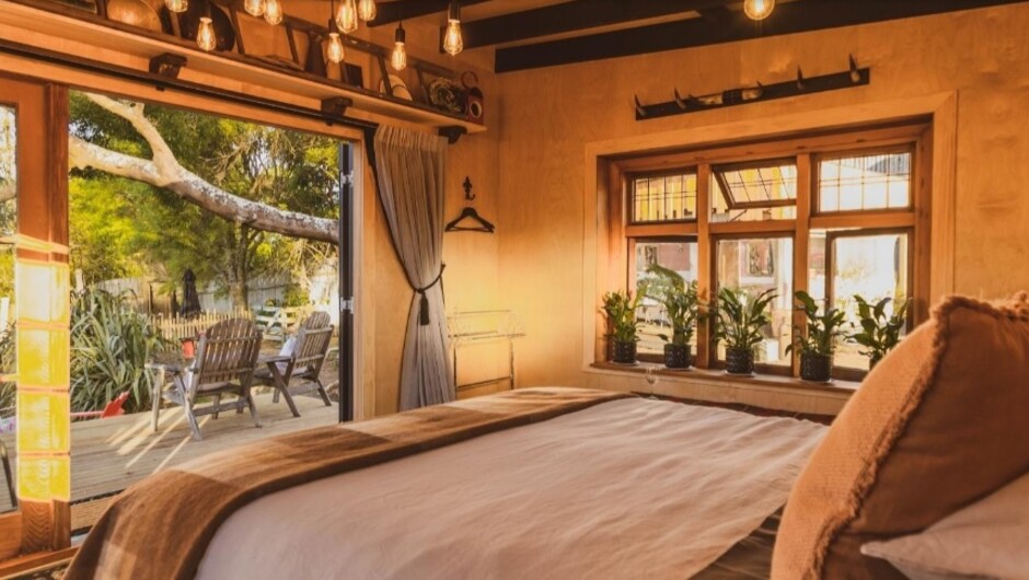 Gaze from bed to bath-on-jetty to lake.