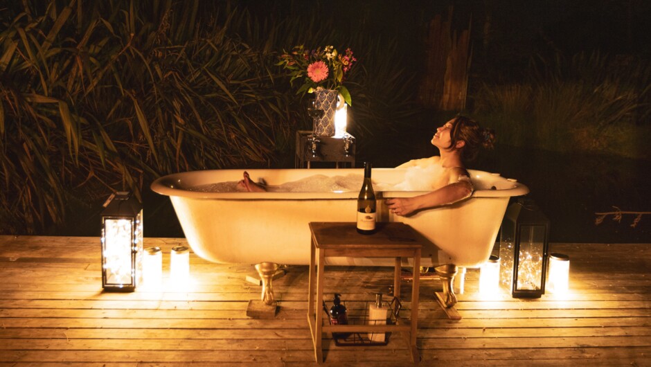 Indulge: instant hot water bath on jetty above small lake