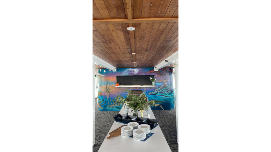 Lower Deck dining area featuring artwork of Hinemoa and Tutanekai