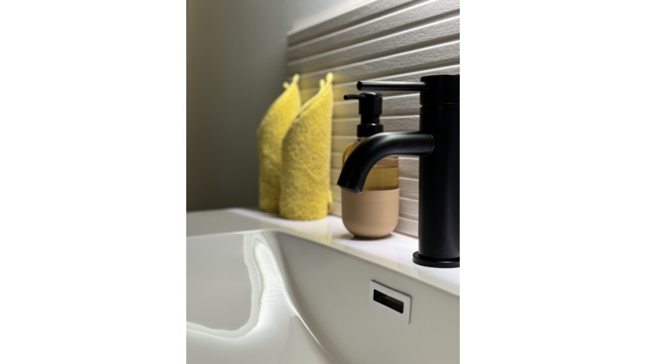 Dressing room with a large vanity is separate to the shower room, and we supply fluffy robes, slippers and eye masks for your comfort.