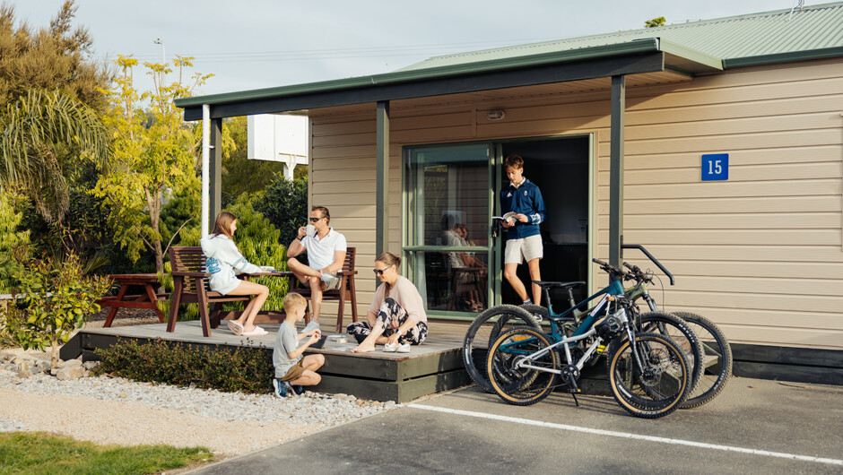 Family relaxing at Tahuna Beach Holiday Park
