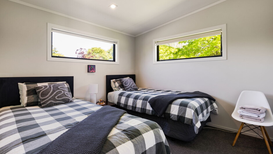 Kaipaki Kids Room - two king single beds in a spacious room