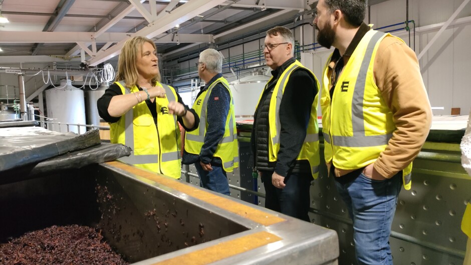 Customers learn about fermentation of Pinot Noir