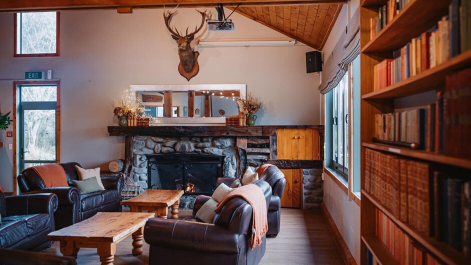Makoura Lodge Venue - relaxing area in front of open fire