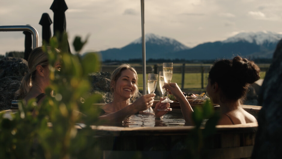 Ladies enjoying bubbles in the Serenity solar tub.
