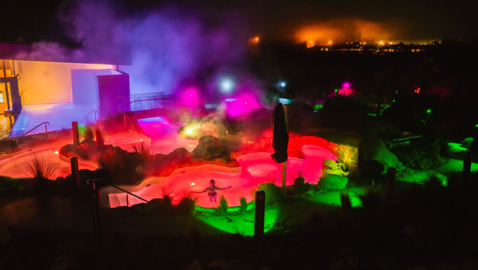 The hot pools lit up at night
