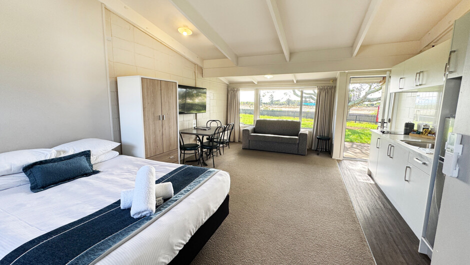 Open-plan kitchen, dining, lounge and bedroom area