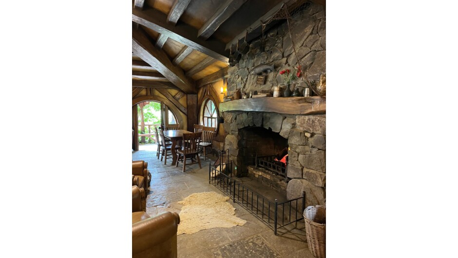 The cozy heart of the Green Dragon Inn. Wrap up your guided walk with a complimentary refreshment by the fire.