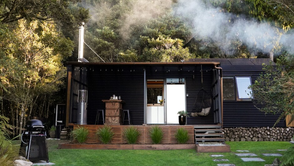 Cabin nestled into the bush.