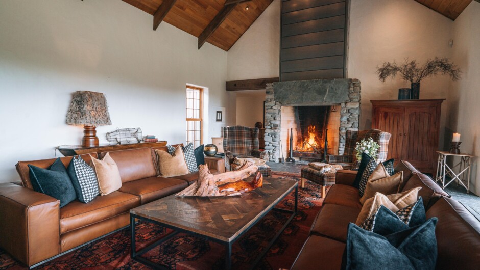 The central living area includes two expansive lounges with soaring cathedral ceilings and huge open fireplaces.