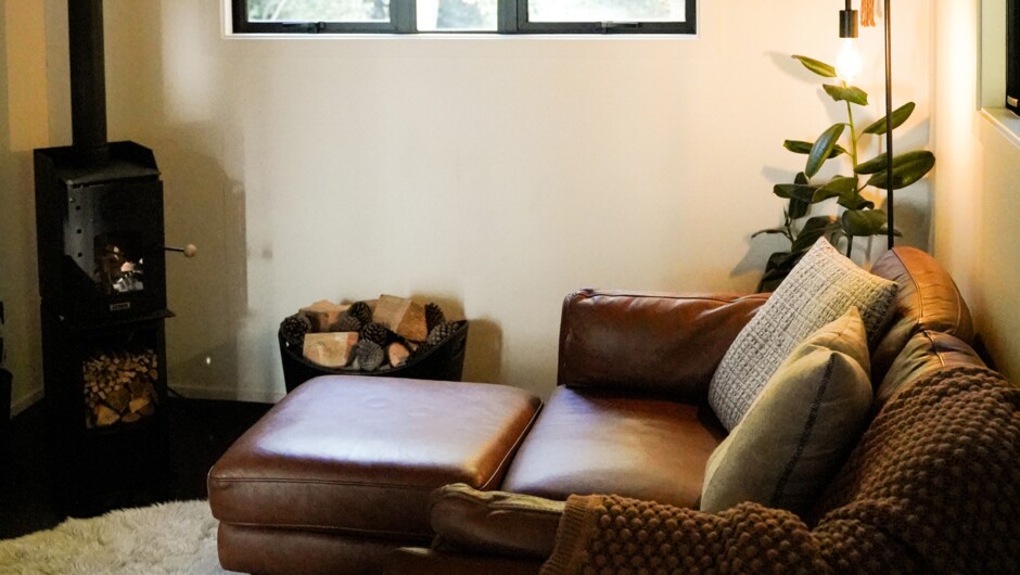 Cosy sitting room with wood burner.