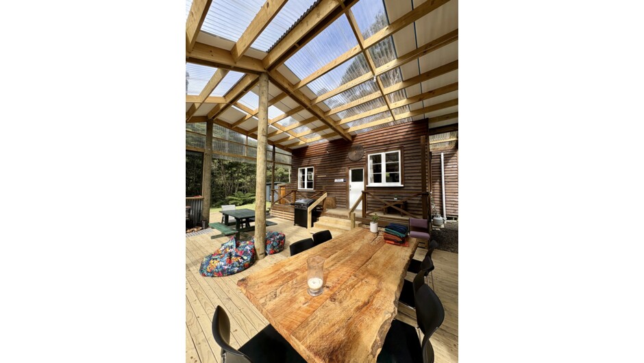 Relax in our sheltered outdoor living space at Whitestar Station, a 1,143-hectare family farm in Northern Coromandel. The perfect off-grid bush retreat for groups and Whitestar Trail Walkers to unwind in nature.