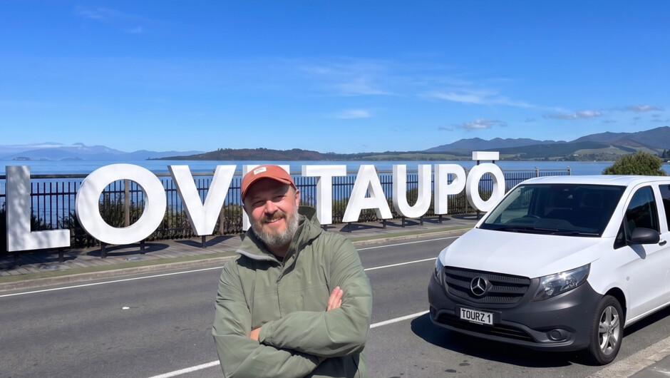Your local Great North Tours guide and premium Mercedes Vito transport at Taupō’s iconic lakefront.