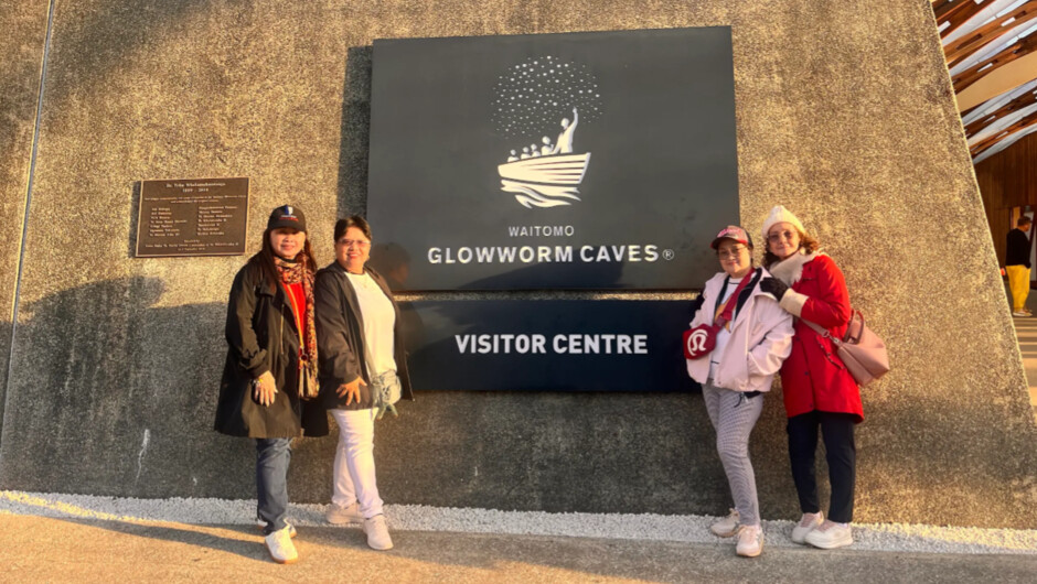 Happy guests getting ready to discover the underground magic of the world-renowned Waitomo Glowworm Caves.