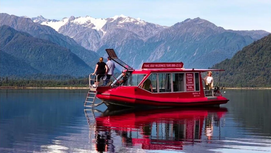 Scenic boat tours and guided walks on Lake Mapourika, West Coast New Zealand.