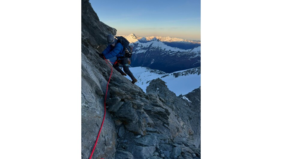 Climb Mt Aspiring. On the traverse to gain the NW buttress