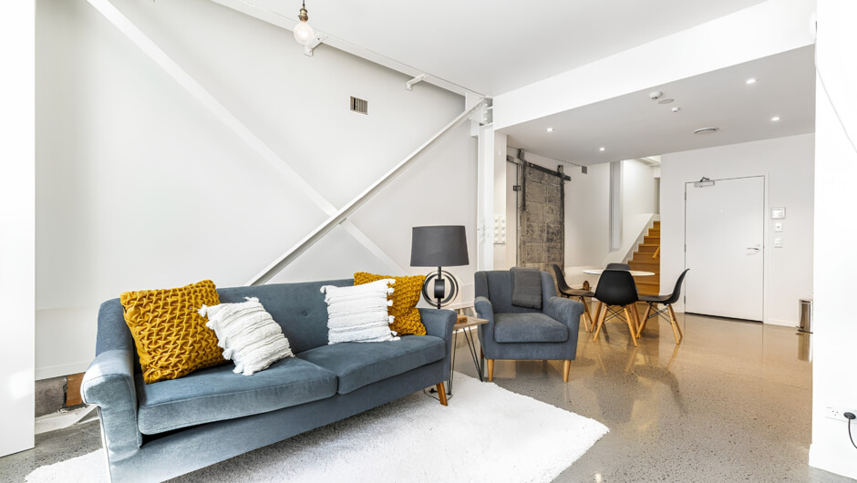 Open-plan living area with direct access to the kitchen