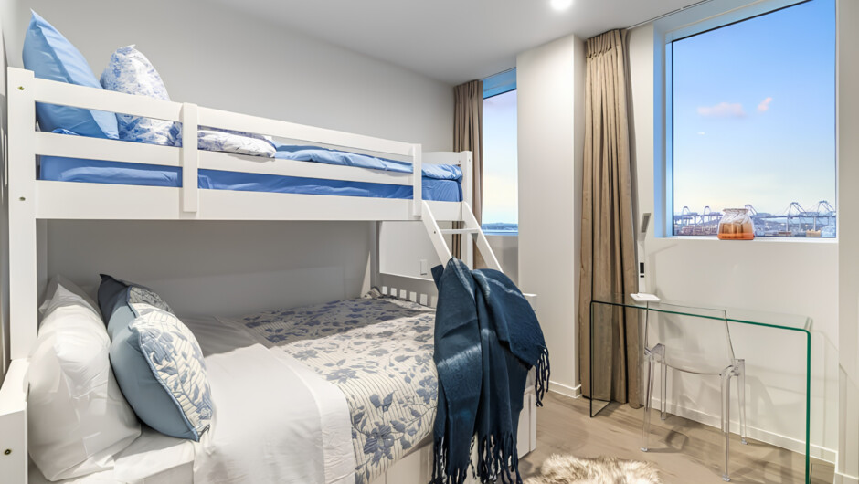Second bedroom features sturdy triple-bunk bed - double on the bottom, single on top