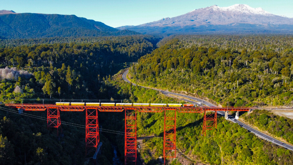 GVR Tour Train crossing the Makatote Viaduct with Mt. Ruapehu behind