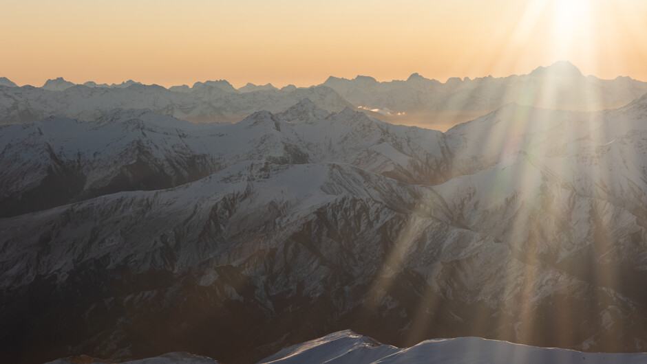 Golden hour views across the Wakatipu Basin on an Air Milford flight