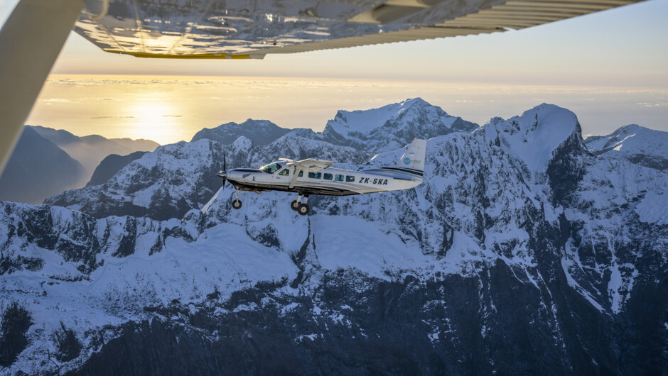 Aerial views of Queenstown town and alpine landscape in evening light