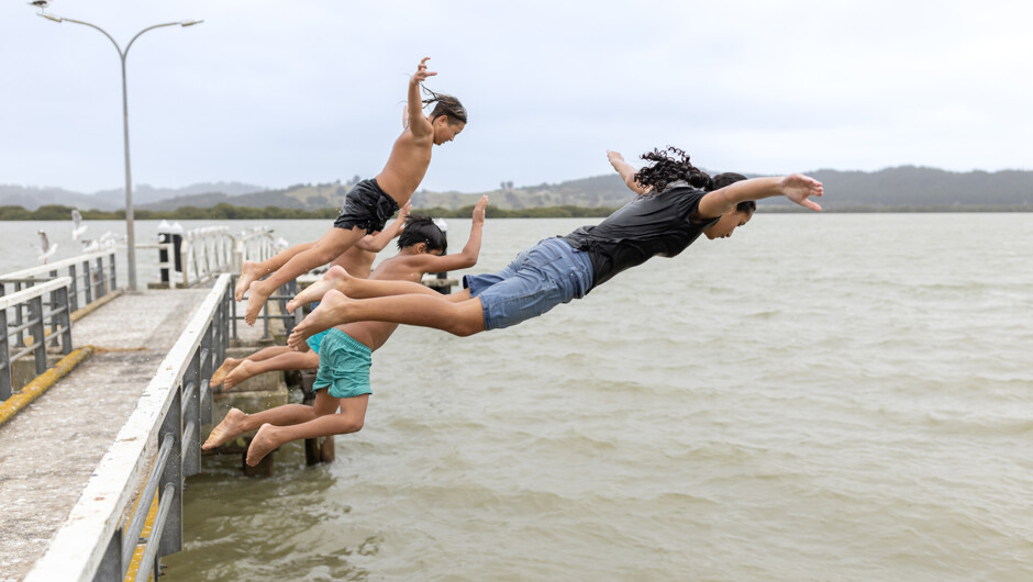 Jumping off Rawene Wharf
