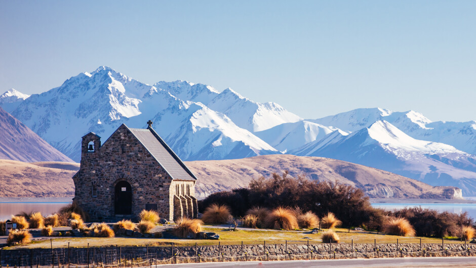 Stop at the stunning Lake Tekapo and famous Church of Good Shepard