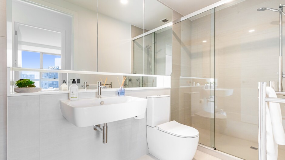 One of the 2 bathrooms in this 3-bedroom Auckland CBD apartment