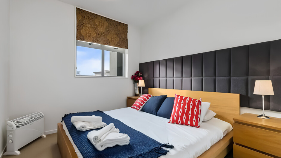 One of the 2 bedrooms of this Auckland CBD apartment