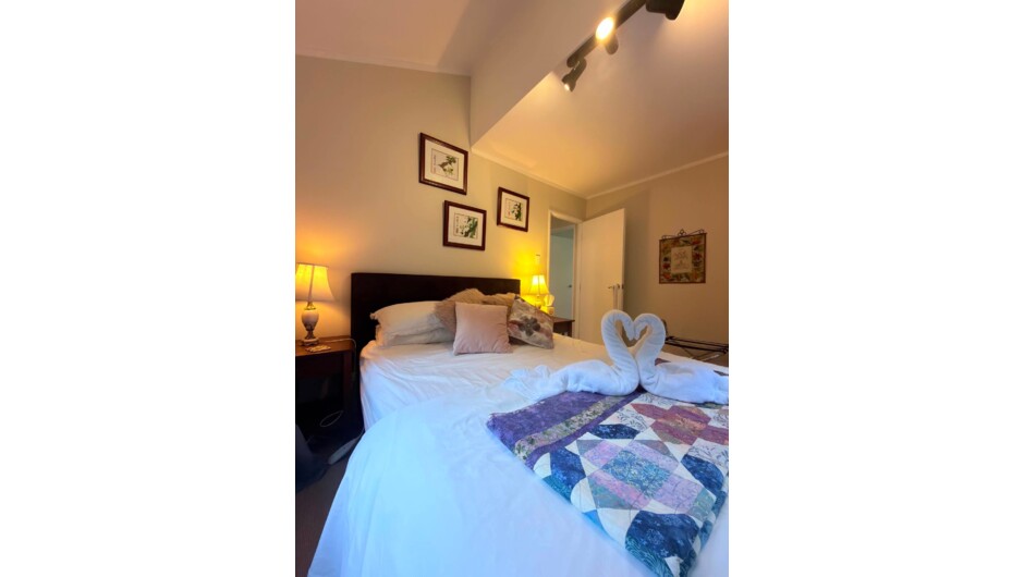 The Nikau Suite has the queen bed and spa.  Views to the ocean and forest.
