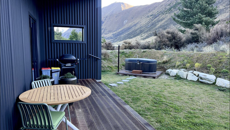Covered deck with table, chairs &amp; BBQ, plus electric hot tub &amp; private mountain views
