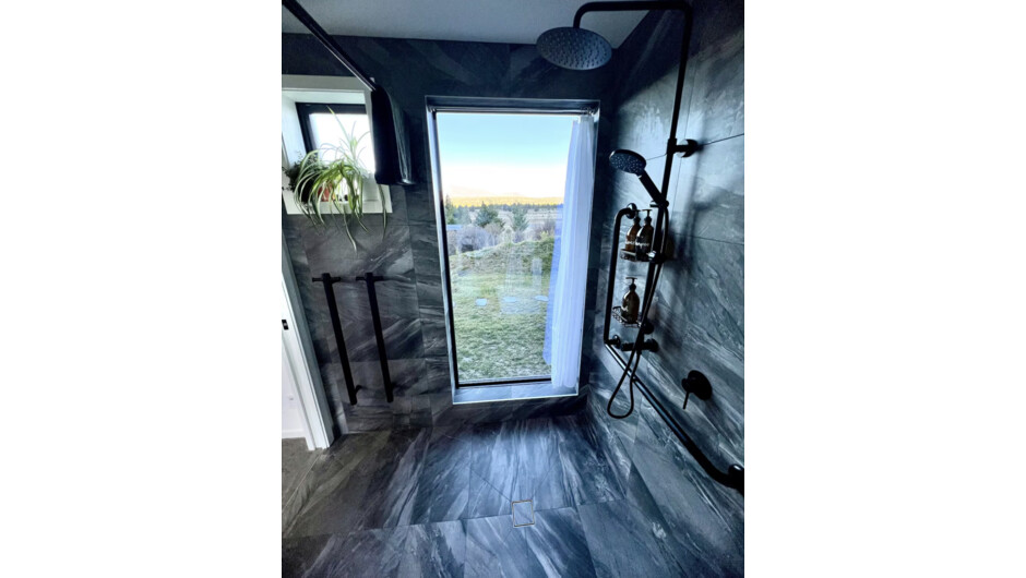 Bathroom with walk-in shower &amp; rainhead and one-way window
