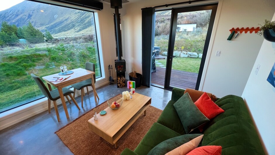 Cosy living &amp; dining area with fireplace and amazing private views of the mountains