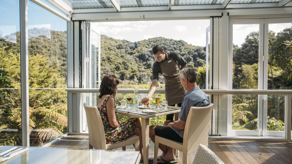 Couple dining at Awaroa Lodge.