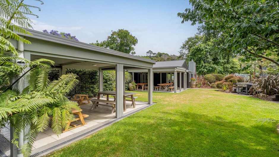 Campground covered seating areas with BBQs